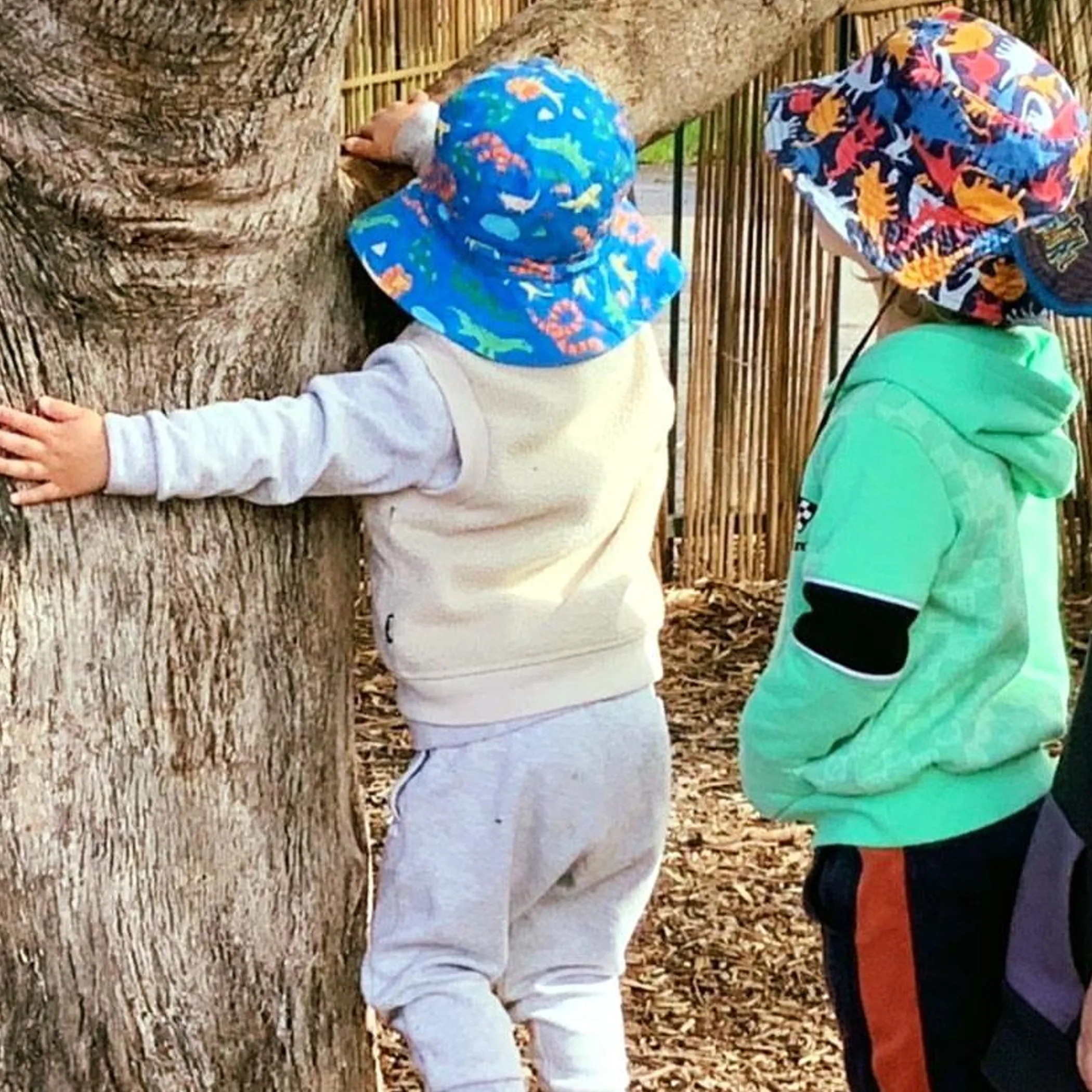 children wearing sun hats outdoors