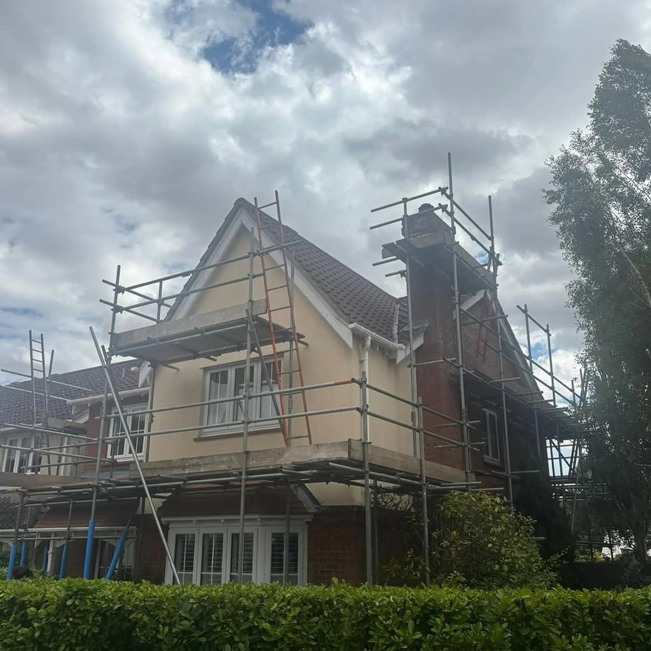 residential roof work with scaffolding