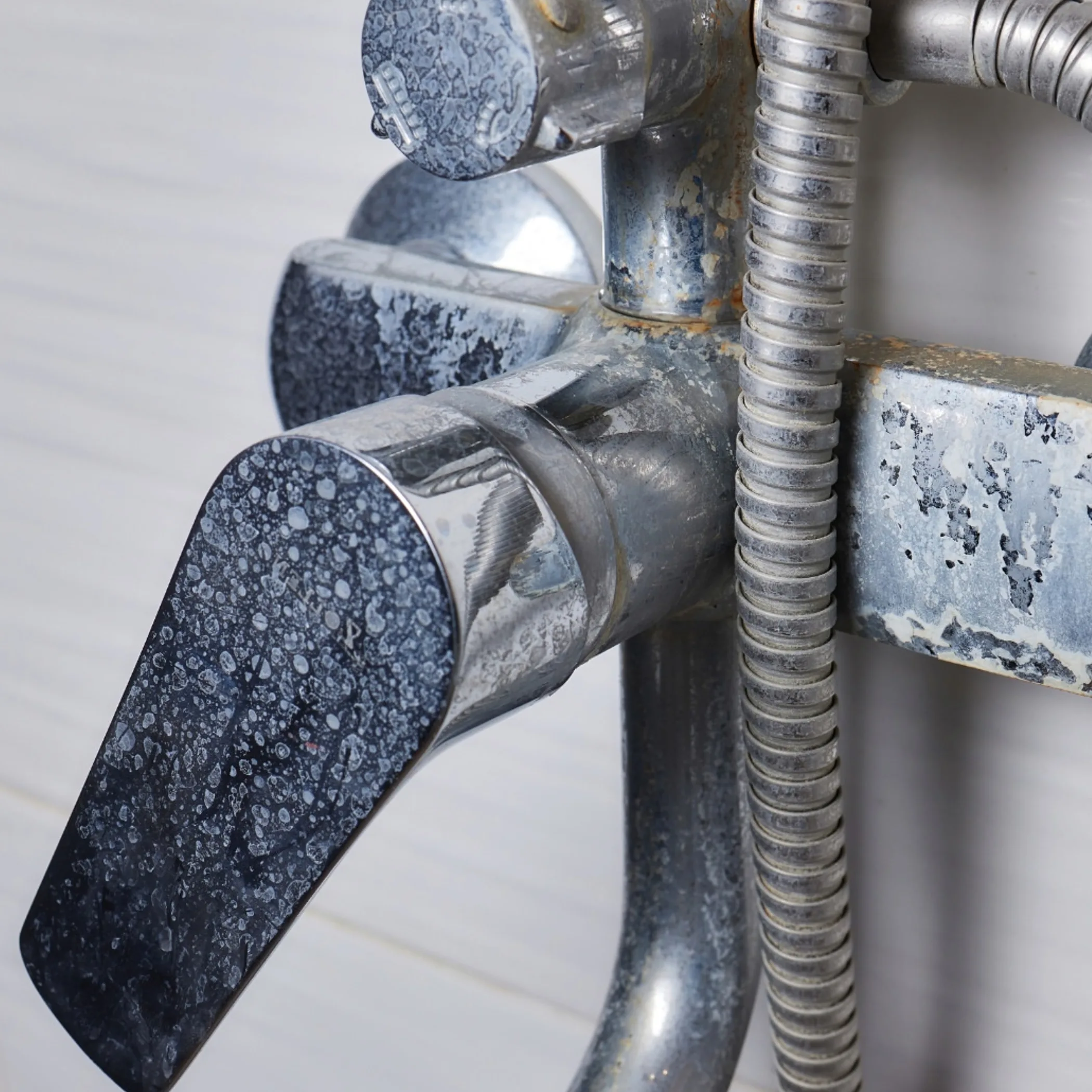mineral buildup on plumbing hardware
